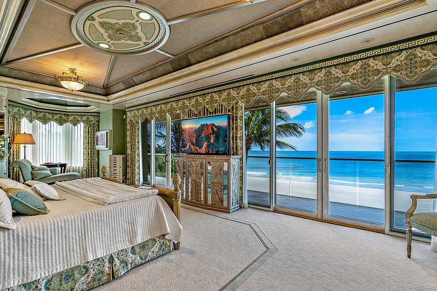 Floor-to-ceiling windows take advantage of the beachfront views.