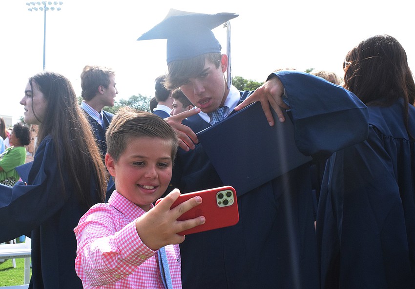 Ten-year-old Dillon O'Callaghan takes a selfie with his brother Cameron O'Callaghan, who graduated from the Out-of-Door Academy.