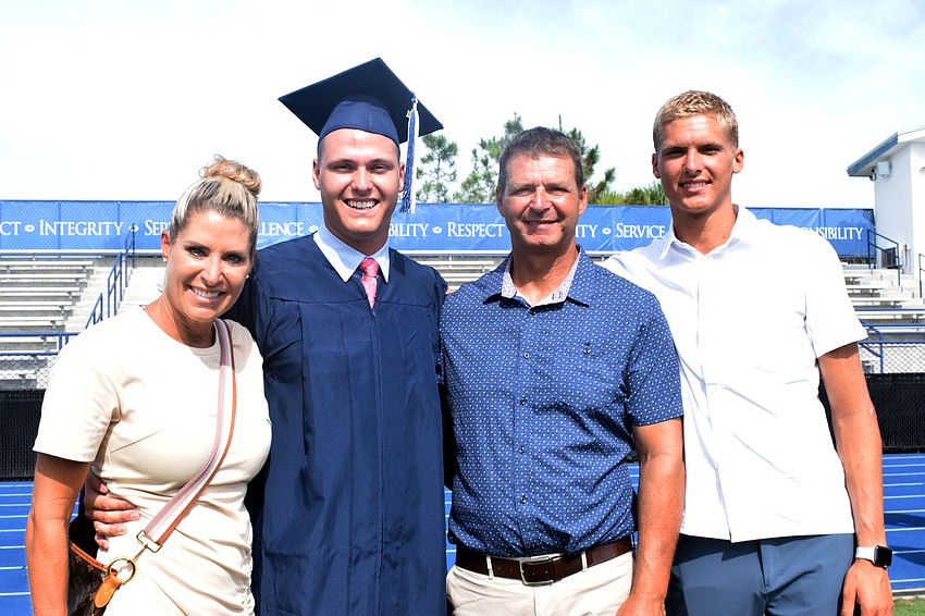 Michelle Schanz is proud of her son Marco Schanz for graduating. They celebrate with Joe Schanz and Lucas Schanz.