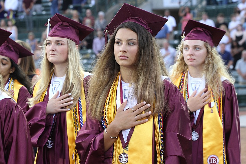 Students pledge allegiance to the flag.