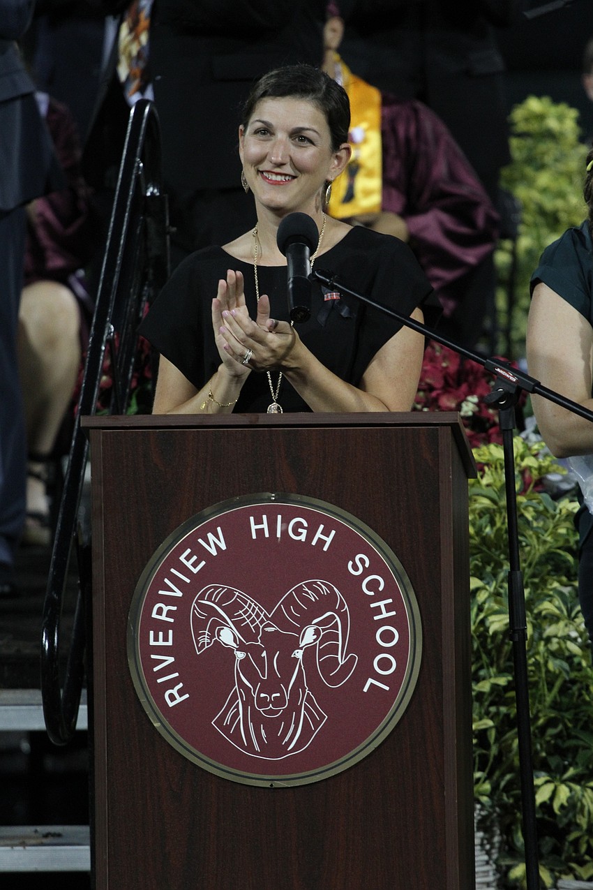 Principal Erin del Castillo applauds the class of 2021.