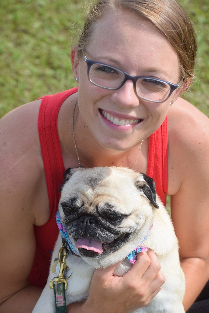 Paige Lautzenheiser, the director of operations at the Sarasota Polo Club, brought polo club owner James Miller's pug, Passie, to the event.
