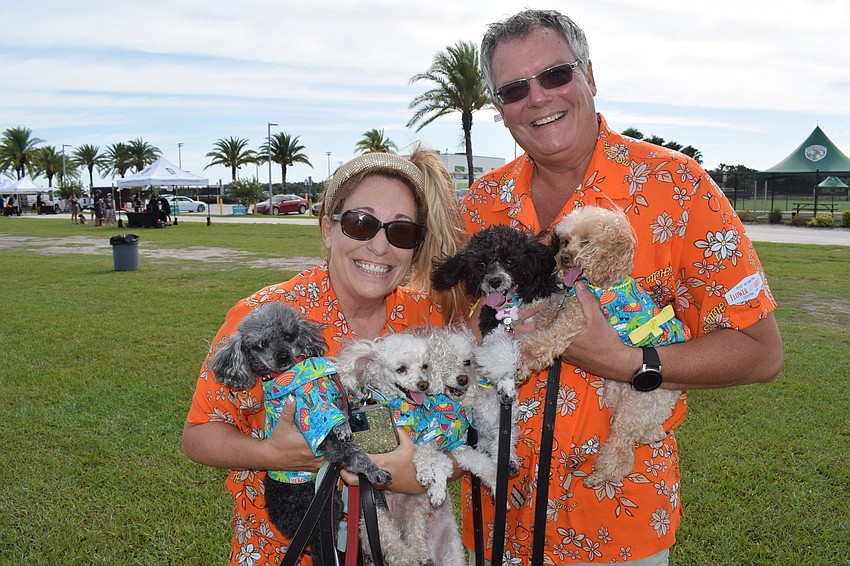 Sheila and Eric Nichols of Venice hold Shaker, 10, Martini, 9, Salt, 7, Olive, 1, and Margarita, 6, at Pups at Premier.