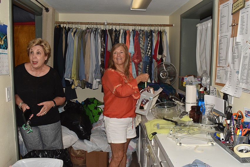 Karen Pashkow leans in to see the progress of Virginia Luke.