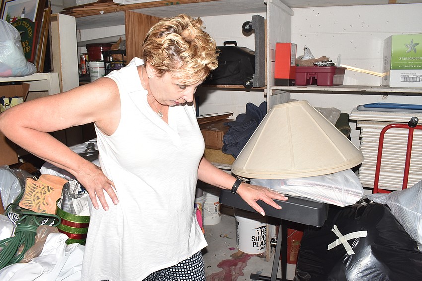 Karen Pashkow navigates the shed.