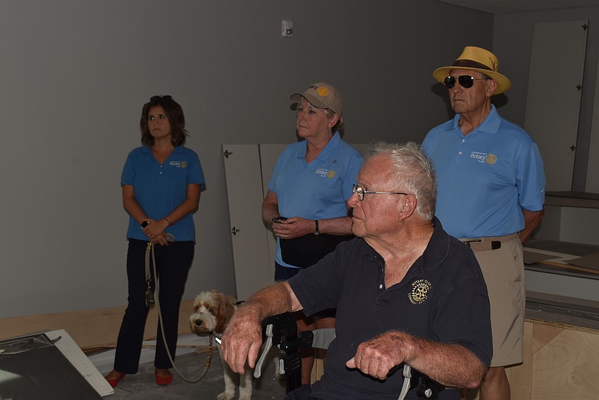 John Brill, front, takes in the new fire station's kitchen.