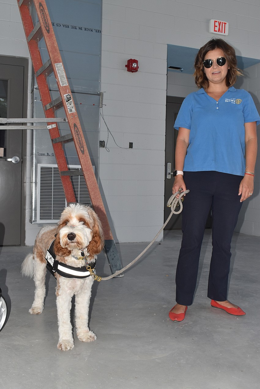 Sidney Turner and her therapy dog-in-training, Journey, watch the tour.