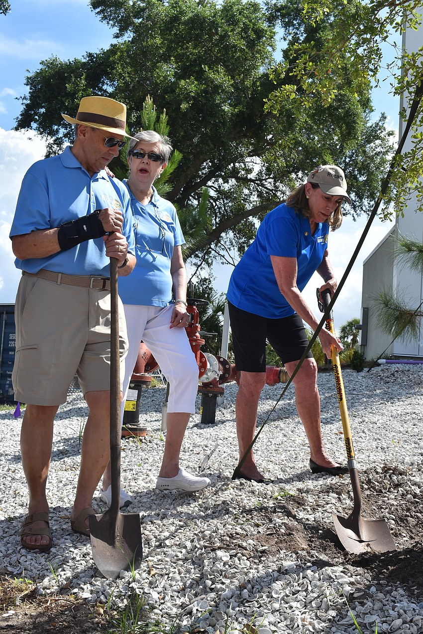 Sam DiGiammarino, Brenda Lee and Nancy Rozance help out with the dirt.