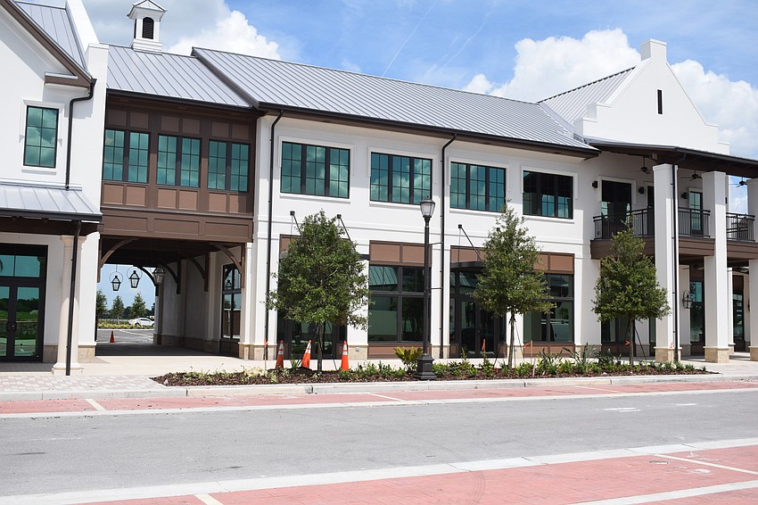 Landscapers are putting the finishing touches on Waterside Place.