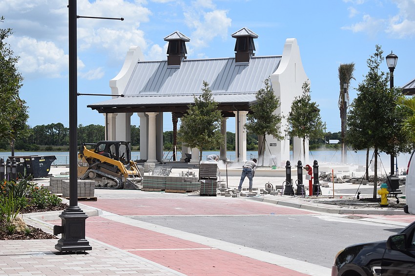 Workers in front of Merchants Park.