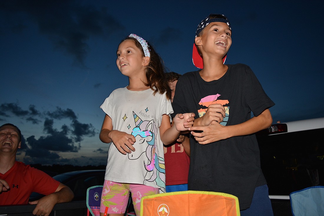 Parrish&#39;s Samara and Joel Pineda excitedly watch as the 2020 fireworks show at Nathan Benderson Park begins to shoot across the skyline. File photo.