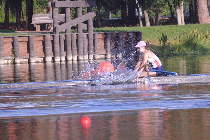 Sarasota Crew's Eva Harris splashes the water at Nathan Benderson Park after finishing second in the Women's 1x Final A at the 2021 USRowing Youth National Regatta.