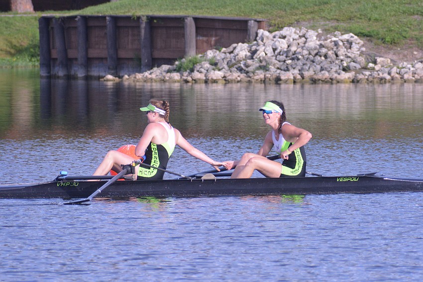Connecticut Boat Club's Sophia Greco and Bridget Galloway clap hands after winning the Women's 2- Final A at the 2021 USRowing National Regatta (7:42.97).
