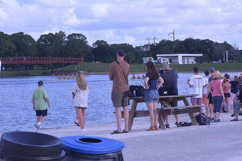 Fans watch the 2021 USRowing Youth National Regatta's Men's 4x Final A from the Regatta Island beach at Nathan Benderson Park.