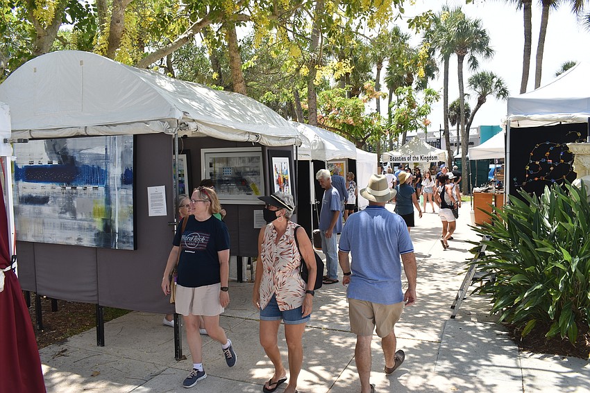 Shoppers passed through the booths, doing their best to avoid others.