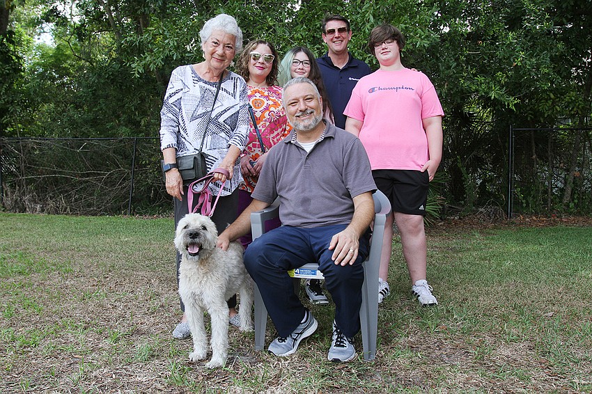 Rabbi Michael Shefrin with Michele Wieckowski, Lisa Grimes, Piper Grimes, Ben Grimes and Patsy the dog.