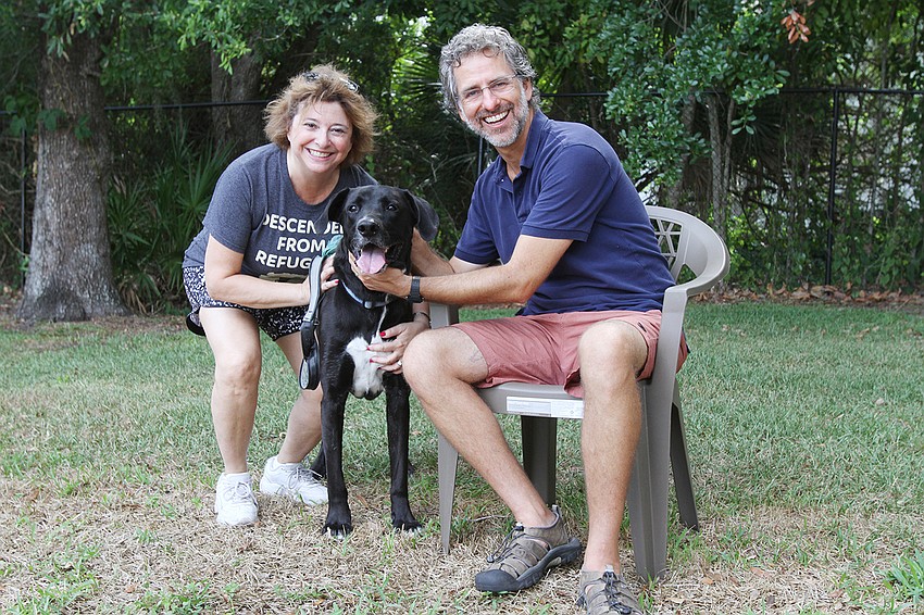 Susan Schlossberg takes Harley the dog to Rabbi Brenner Glickman