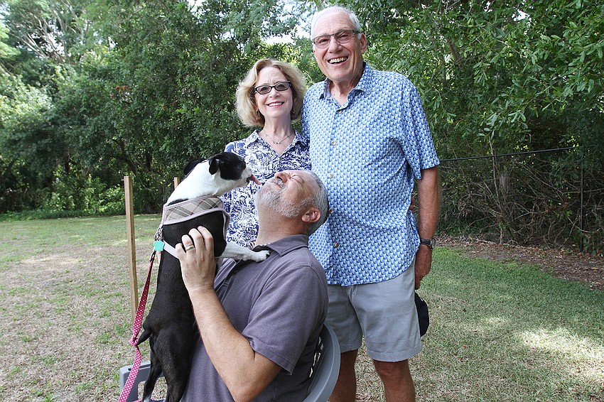 Bettianne and Hal Marcu takes Daisy the dog to Rabbi Michael Shefrin