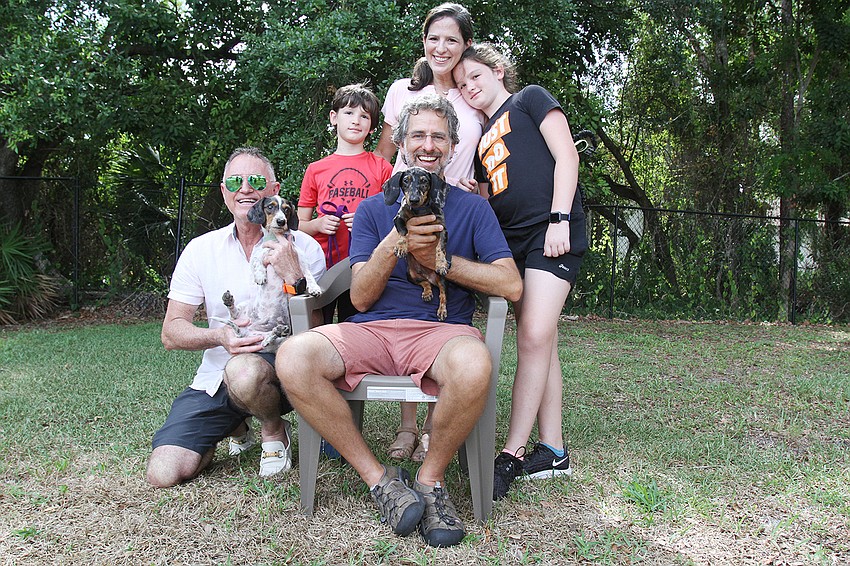 Rabbi Brenner Glickman with Eduardo Marin, Jay Mazer, Barbara Mazer-Marin and Ansley Mazer  with Simcha and Schulan the dogs.