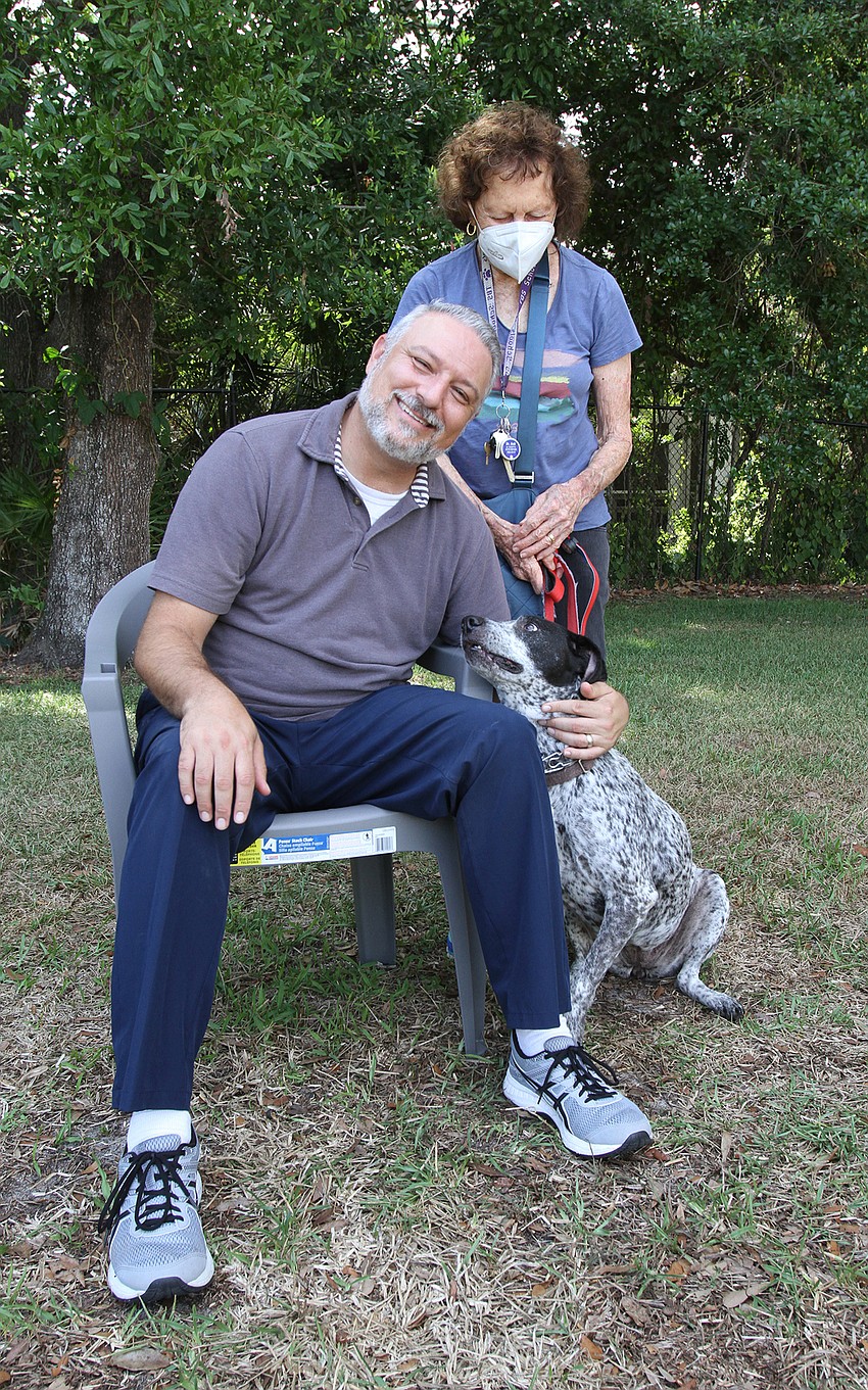 Rabbi Michael Shefrin with Sharlya Gold and Cleo the dog.