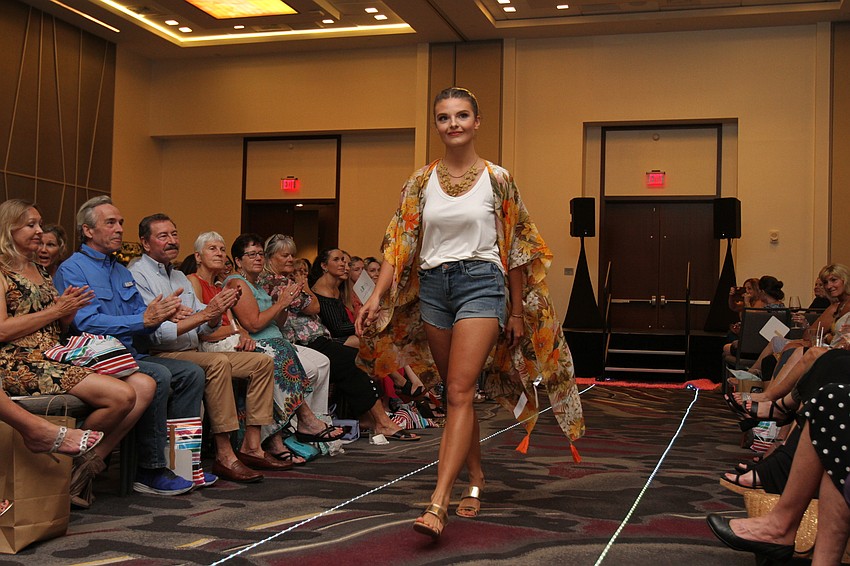Models walk the runway wearing items from Pink Sebastian Boutique.
