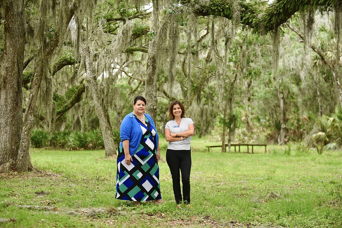 Executive Director Lisa Intagliata and founder and board Chair Sidney Turner stand on the site of their future Resilient Retreat property in East Sarasota County.