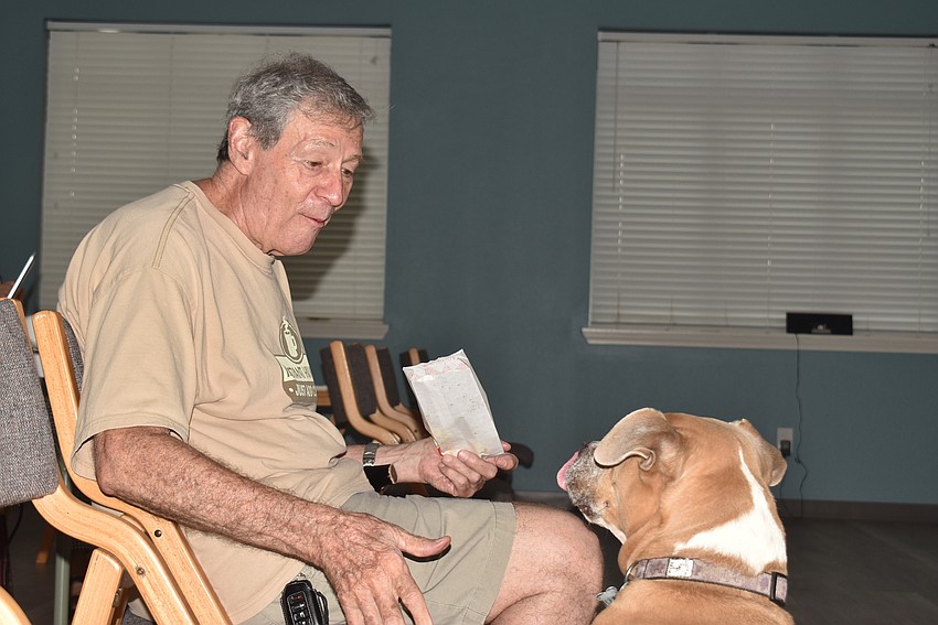 Jack Ernst had Lahni Brenner give him her paw before giving her popcorn.