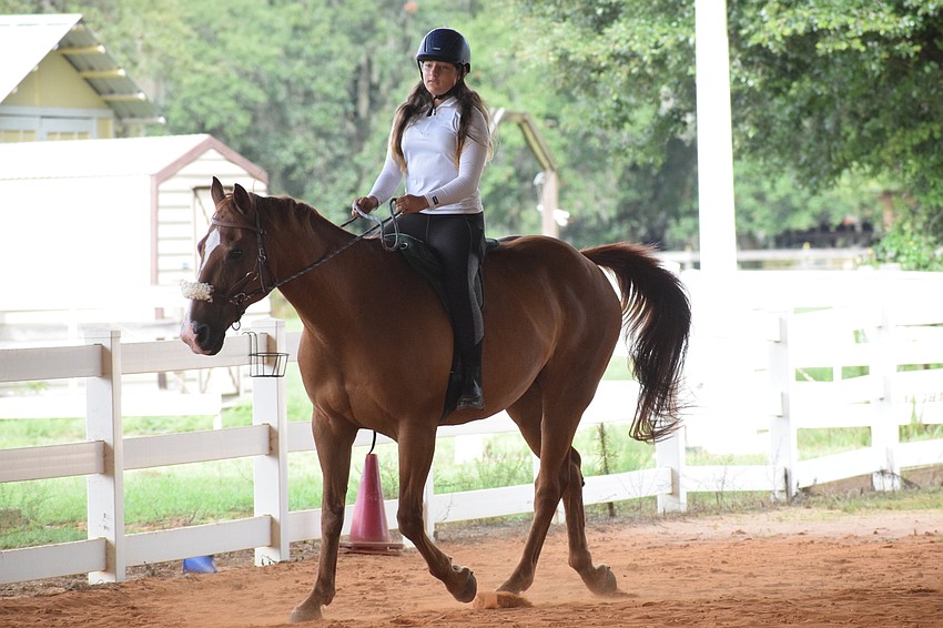 Isabella Hackett, who is 11, has Cherokee trot around the arena for a few minutes.