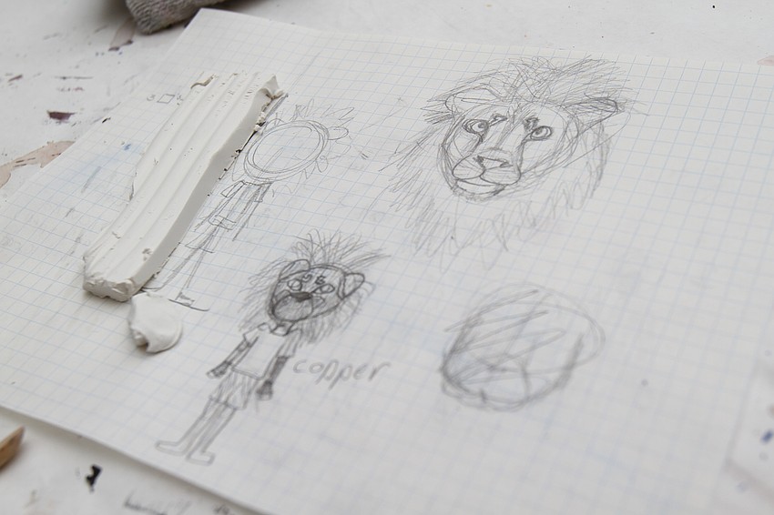 Francesa Bisordi, 12, slowly crafts her lion human figure.
