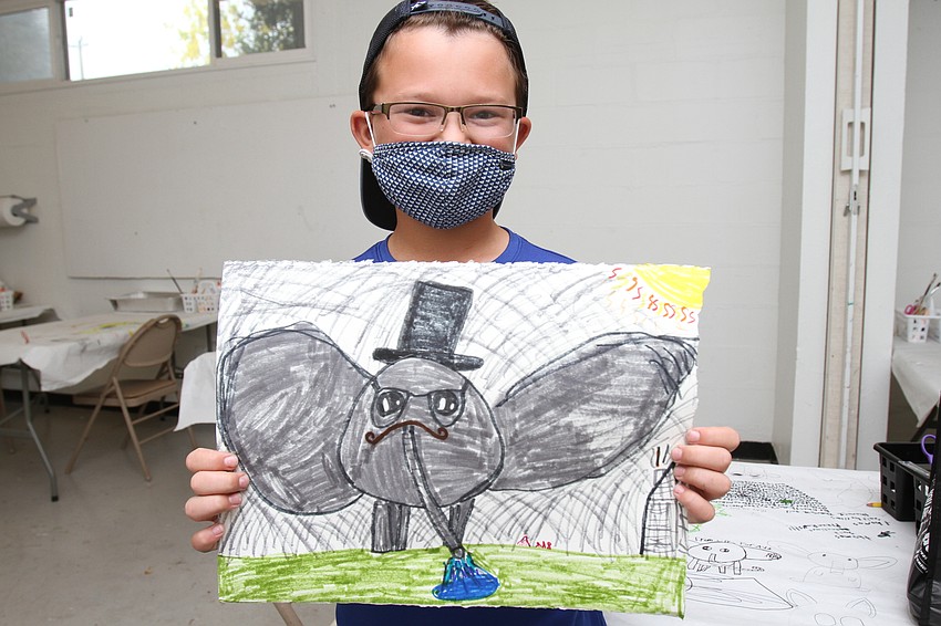 Max Cocozza, 8, proudly shows off his elephant.