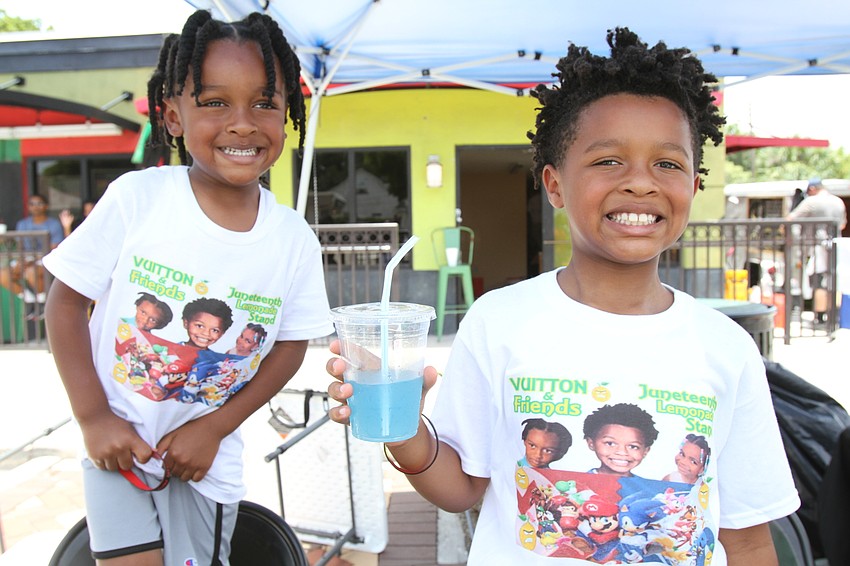 Titan and Vuitton Charles sell lemonade with Vuitton & Friends.