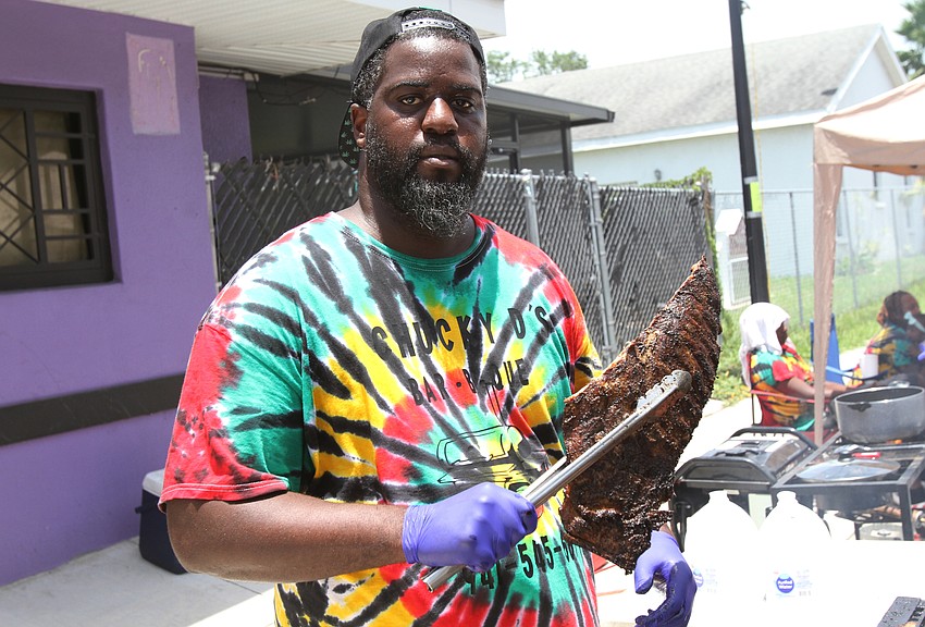 Caleb Hatcher cooks up food with Chucky D's.