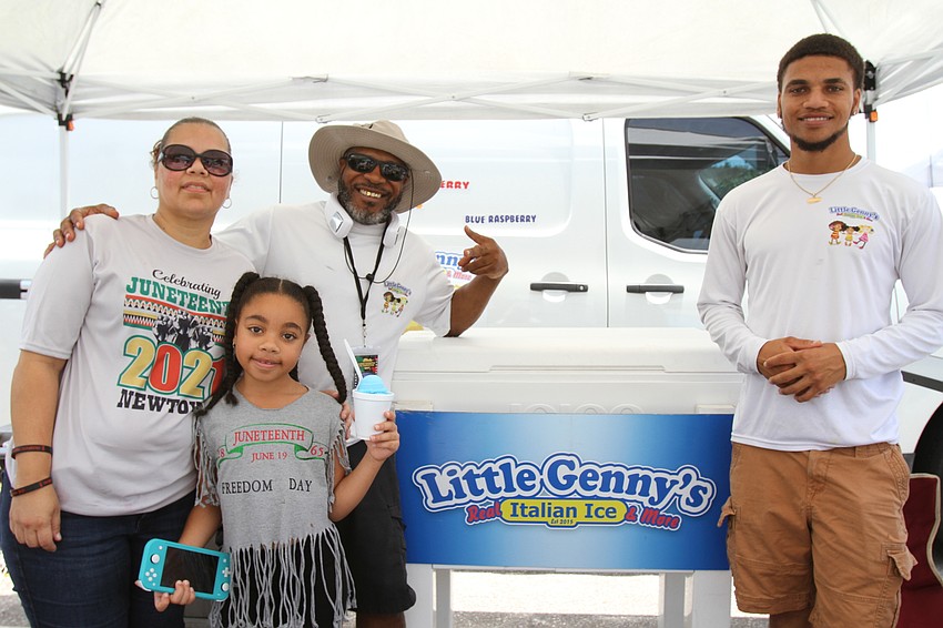 Betsy Williams, Genesis Williams, Calvin Williams Sr. and Calvin Williams sell frozen ice with Little Genny's Italian Ice.