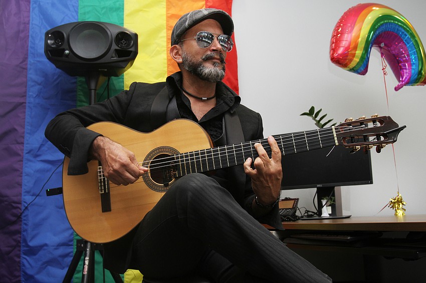 Daniel Muñoz plays guitar for guests.