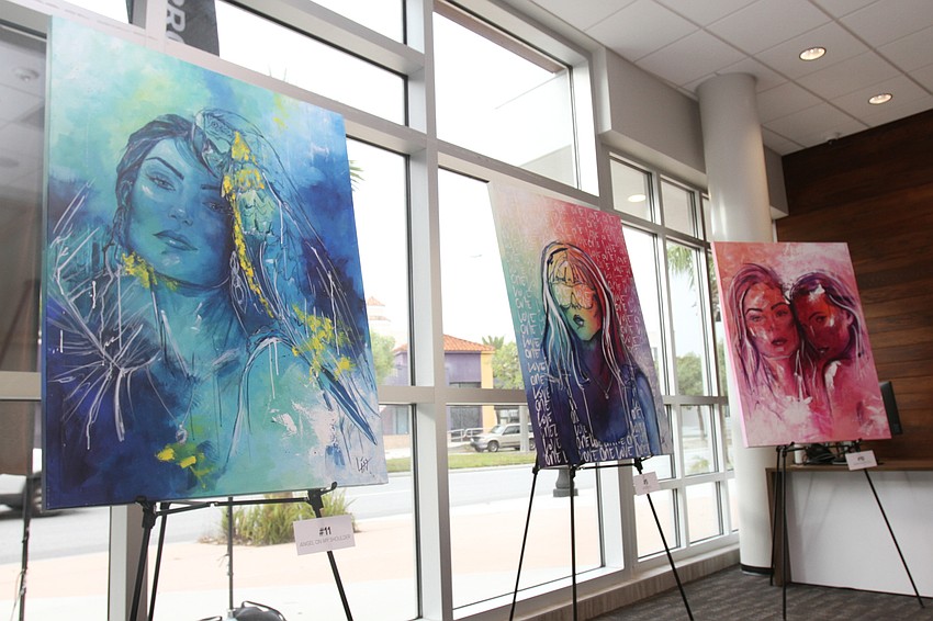 LISS puts several of her art pieces on display.