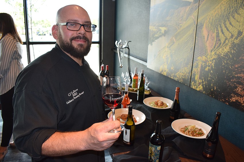 Chef CJ LeFevre prepares dishes that pair nicely with Cooper's Hawk's specialty wines.
