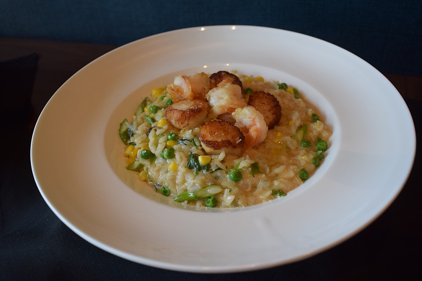 The shrimp and scallop risotto ($29.99) combines sweat corn, asparagus, peas, spinach, parmesan and white truffle oil.