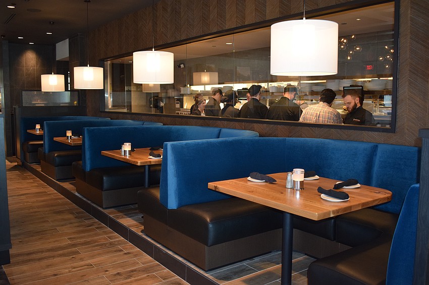 The bustle of the waiters on the food line can be part of the dining experience if so desired.