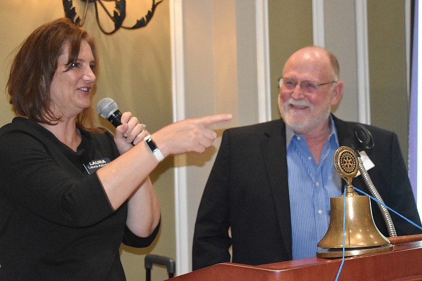 President Laura Adcock speaks during the induction of newly inducted club member Don Hank. Hank did not get to attend any meetings before the dinner because of the pandemic. Adcock was his sponsor.