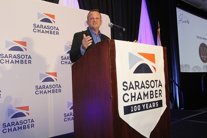 Jim Miller with JMX Brands thanks the audience for receiving the Medium Business Award.