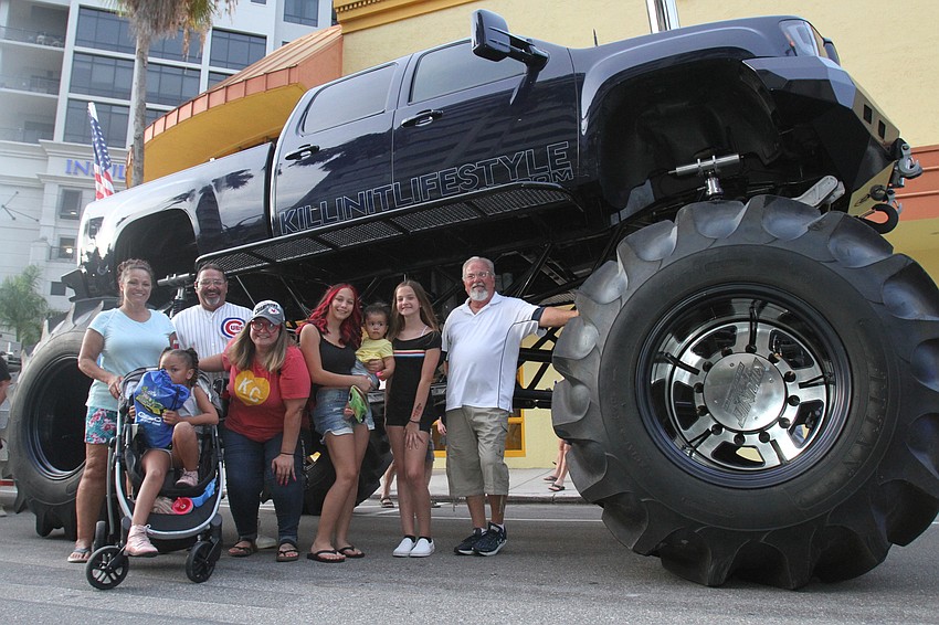 The Palmers take a minute with a monster truck.