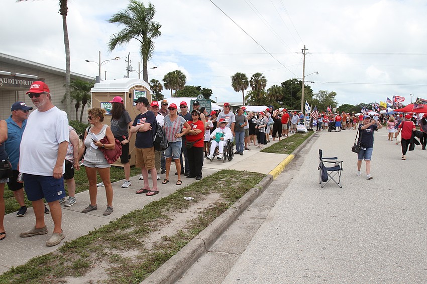 Attendees fill the fairgrounds area.
