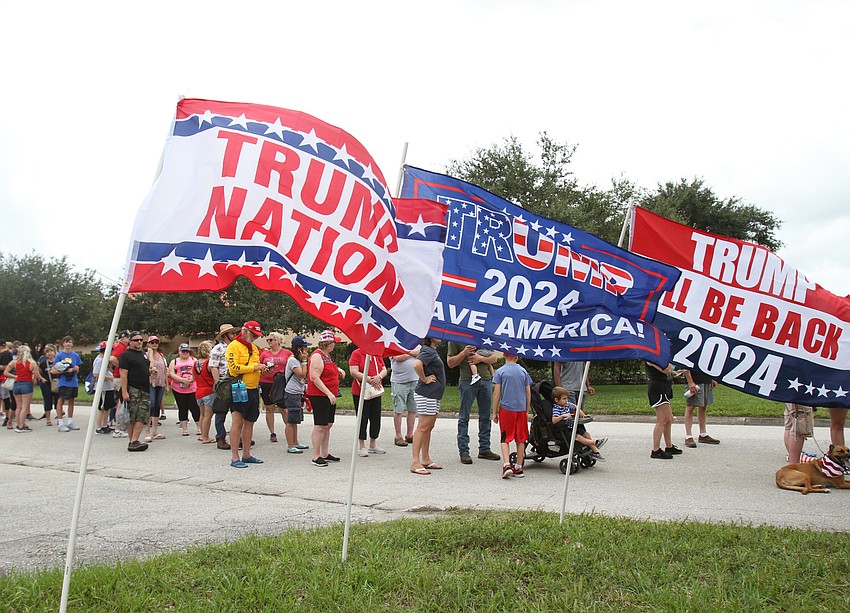 Attendees fill the fairgrounds area.