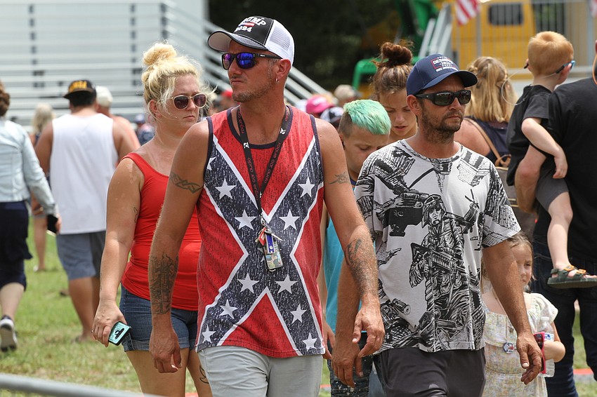 Attendees fill the fairgrounds area.