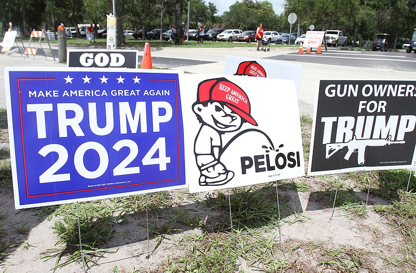 Attendees pick up merchandise at vendors tents.