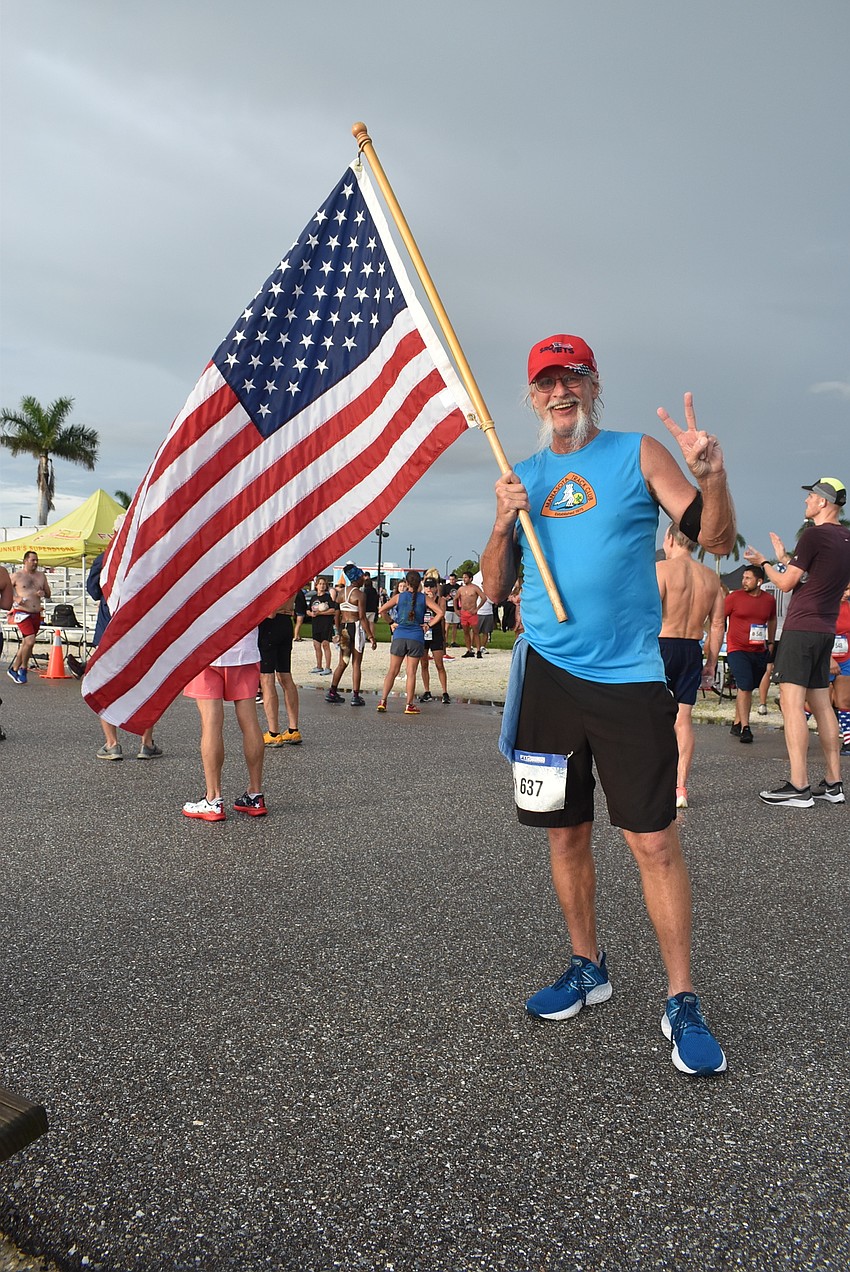 Sarasota's Andy Kish held the American flag for the entire four-mile run, switching arms when one got tired. He finished the race in under 36 minutes.