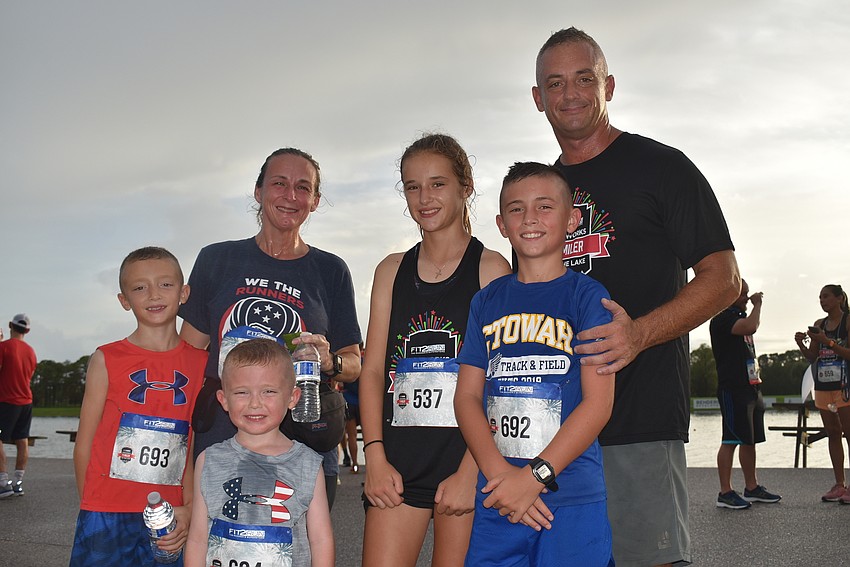 Country Meadows residents Aaron Westrip, 8, Holly Westrip, Michael Westrip, 5, Elizabeth Westrip, 12, Charlie Westrip, 10, and Chuck Westrip ran the four-mile race. They also complete in triathlons.