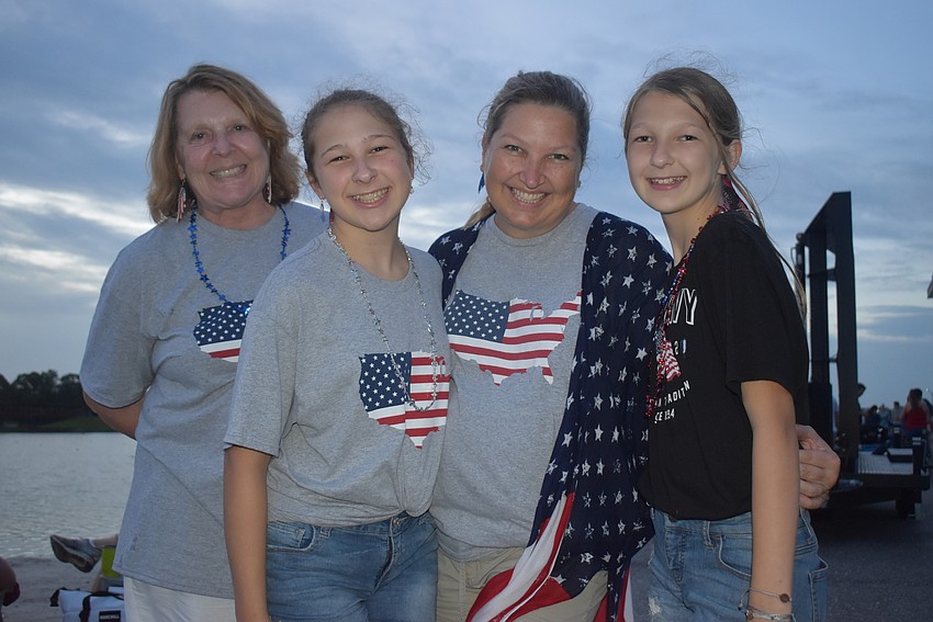 Sarasota's Rebecca Cantrell is visited by Anastasia Jones, 13, Alexis Jones and Piper Jones, 11, who are from Chesapeake, Virginia. Anastasia enjoyed seeing people celebrate together after a year of pandemic restrictions.