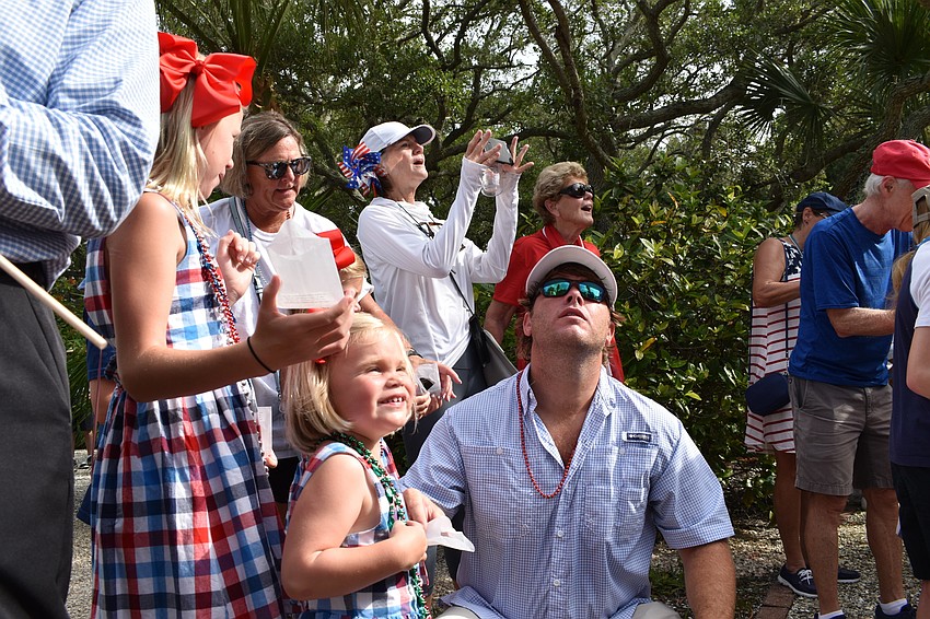 Dozens gathered around for the Longboat Key Garden Club's butterfly release.