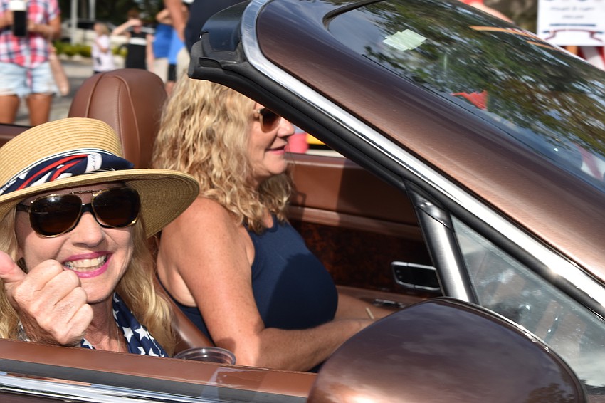 Dr. Colleen Healy waved during Sunday's Freedom Fest parade. Healy served as one of the parade's grand marshals.
